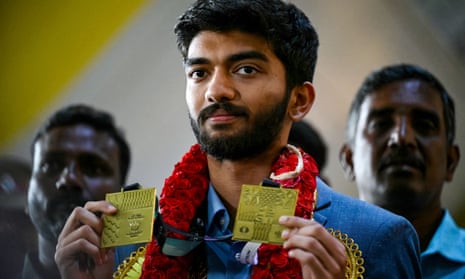 Gukesh Dommaraju shows the Olympiad medals he won in Budapest after arriving in Chennai