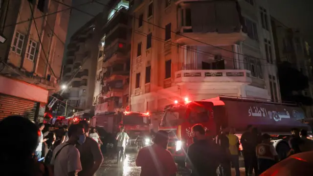 Emergency vehicles and people everywhere in Beirut