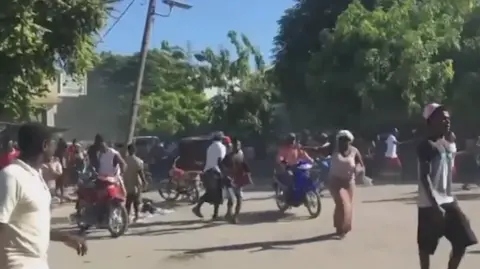 AP People could be seen fleeing the violence on motorbikes and on foot