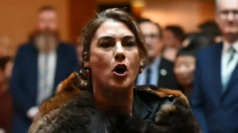 Reuters King Charles is heckled by Australian politician Senator Lidia Thorpe before she was escorted away by security at the Australian Parliament House for Ceremonial Welcome and Parliamentary Reception, Canberra, Australia October 21, 2024