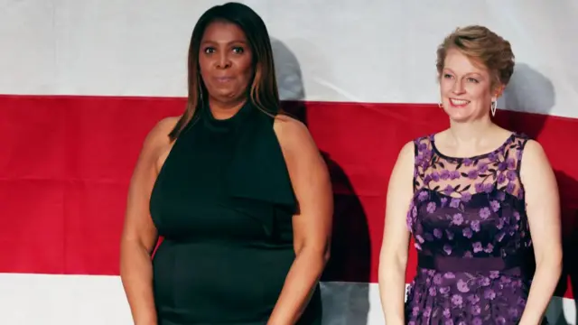 New York Attorney General Letitia James, in a black dress, stands during the 79th annual Alfred E Smith Memorial Foundation Dinner