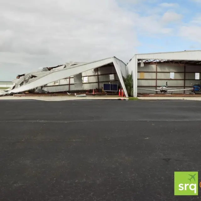 A damaged airport hangar at the Sarasota Bradenton International Airport after Hurricane Milton ripped through the area