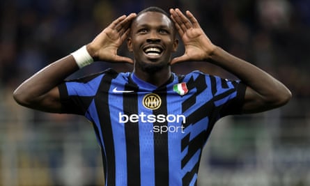 Marcus Thuram celebrates after scoring the first goal of his hat-trick against Torino.