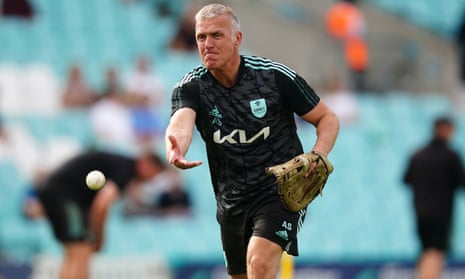 Alec Stewart throws a ball