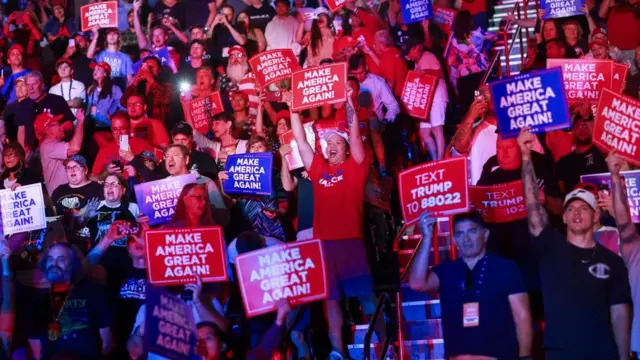 Supporters react as they attend Republican presidential nominee and former U.S. President Donald Trump's campaign event sponsored by conservative group Turning Point Action, in Las Vegas, Nevada