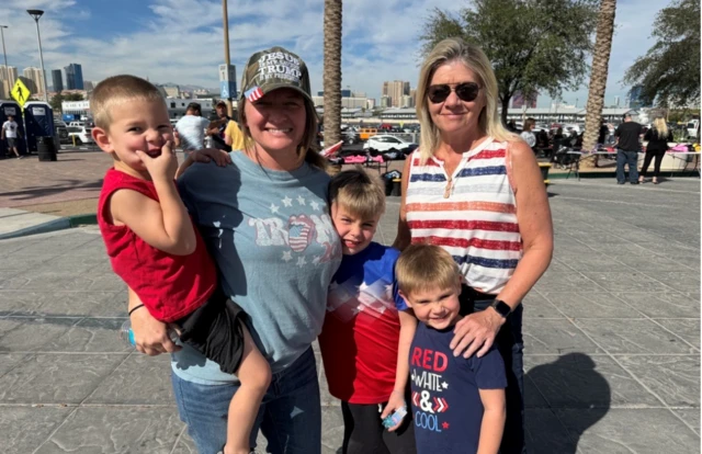 Heather Splawn stands with her mother and three children