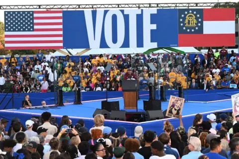 Getty Images Spike Lee addresses the crowds with big 'VOTE' banner behind