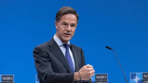 Getty Images Mark Rutte speaks during a news conference