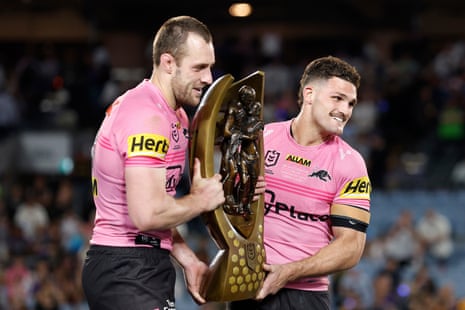 Isaah Yeo and Nathan Cleary of the Panthers hold the 2024 NRL premiership trophy