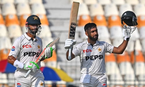 Abdullah Shafique (right) celebrates reaching his hundred alongside Pakistan’s captain, Shan Masood.