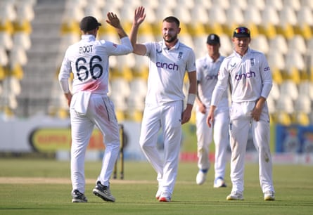 Gus Atkinson celebrates his second wicket of the day with the dismissal of Abdullah Shafique.