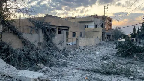 AFP Damaged buildings at the scene of an Israeli air strike in Kayyal, Baalbek, eastern Lebanon (31 October 2024)