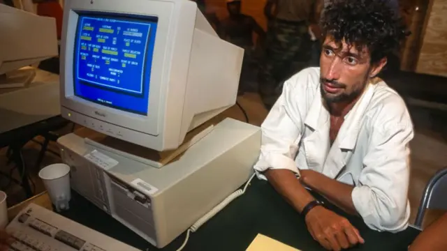 A Cuban migrant being registered by US authorities in 1994 after being intercepted at sea on his way to the US